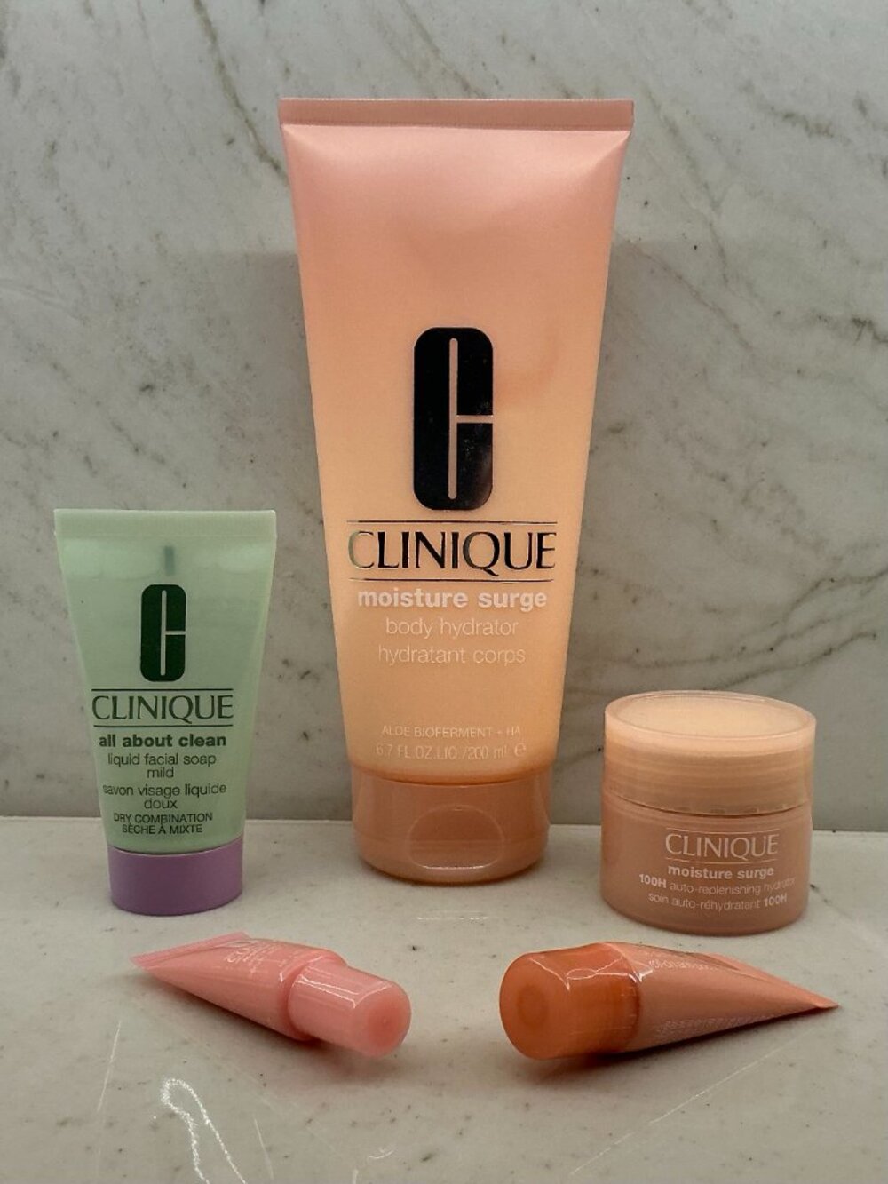 NWT Clinique Full Size and Four Travel Sizes - "Moisture Surge" and "All About"